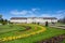 Ludwigsburg royal palace historic building in spring time with beautiful garden with flower and green grass and blue sky