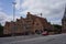 Luebeck, Germany - July 20, 2021 - Six red-brick buildings, the Salzspeicher along the Trave waterfront near the Holstentor