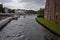 Luebeck, Germany - July 20, 2021 - Six red-brick buildings, the Salzspeicher along the Trave waterfront near the Holstentor