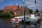 Luebeck, Germany - July 20, 2021 - Six red-brick buildings, the Salzspeicher along the Trave waterfront near the Holstentor