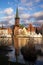 Luebeck, old town view with St. Petri church in red brick architecture with reflection the the river Trave, famous city in