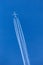 Lufthansa Airbus A340 large airliner flying at high altitude with a large contrail behind it.