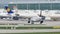 Lufthansa and Etihad jets taxiing in Munich Airport