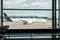 Lufthansa operated regional flight airplane as seen from inside generic international airport terminal taxi towards runway