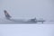 Lufthansa plane doing taxi on runway, snow in winter