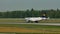 Lufthansa plane landing and Delta airplane taxiing in Frankfurt Airport, FRA