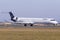 Lufthansa Regional jet lining up runway for departure