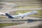 an lufthanse airplane takes off from a runway