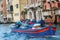 Luggage porters in Venice on the Grand Canal, Italy