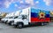 Luhansk People`s Republic flag on the back of Five new white trucks against the backdrop of the river and the city. Truck,