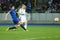 Lukasz Teodorczyk shoots the ball while Antolin Alcaraz tries to block it, UEFA Europa League Round of 16 second leg match between