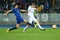 Lukasz Teodorczyk shoots the ball while Antolin Alcaraz tries to block it, UEFA Europa League Round of 16 second leg match between