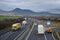 Lukavec, Czech republic - january 16, 2019: traffic on D8 highway in czech central mountains with Lovos hill on horizont