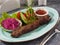Lula veal kebab with tomato sauce, onion and vegetables
