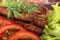 Lulia kebab on a salad with tomatoes and dill