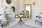 Luluxury rich sitting room interior in beige pastel color with antique expensive furniture in baroque style. walls decorated with