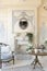 Luluxury rich sitting room interior in beige pastel color with antique expensive furniture in baroque style. walls decorated with