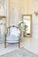 Luluxury rich sitting room interior in beige pastel color with antique expensive furniture in baroque style. walls decorated with