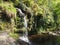 Lumb hole falls waterfall in woodland at crimsworth dean near pecket well in calderdale west yorkshire