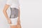 Lumbar brace on the human body isolated on a white background. Trauma of back. Back brace, orthopedic lumbar, support