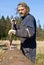 Lumber worker peeling bark