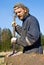 Lumber worker removing bark