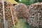 Lumbered chopped firewood for the winter and piled in large packs. Melnsils, Kempings, Latvia 06 June 2019