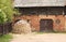 Lumbered chopped firewood for the winter and piled in stacks near the hut. Kuldiga, Latvia May 11, 2019