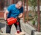 Lumberjack refilling his chainsaw