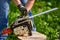 Lumberjack servicing his chainsaw