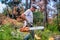 Lumberjack work wirh chainsaw in the forest