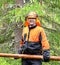 Lumberjack Worker carries, dragging log of special hooks