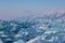 Luminous blue broken ice blocks on mountains background