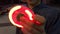 Luminous fidget spinner in hand. Popular trendy toy close-up.