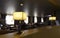 Luminous lamps in hotel with leather sofas and armchairs