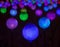 Luminous multi-colored balls, glow in the dark, festive decoration of the city