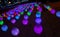 Luminous multi-colored balls, glow in the dark, festive decoration of the city