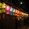 Luminous Night: A Row of Vibrant Lanterns Illuminate the Street