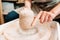 Lump of clay on potters wheel closeup