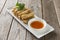 Lumpia Spring Rolls on Wooden Table in Restaurant