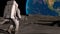 Lunar Astronaut In Space Suit Walking On the Moon. Planet Earth Is Visible. 3d rendring animation