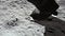 Lunar astronaut walking on the moon's surface and leaves a footprint in the lunar soil. 3d rendering. Some Elements of