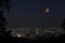 Lunar eclipse over Chiang Mai city. Blood Moon in the lunar eclipse and also a Blue Moon and super moon called Super Blue Blood