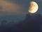 Lunar eclipse whit clouds in blue hour