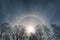 Lunar halo among the clouds at night