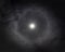 Lunar halo ring around the moon in night time sky with stars in Australia