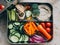 A lunch box filled with veggies and hummus. AI generative image.