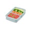 Lunch box with prepared food for delivery. A delicious set of healthy products, pieces of fish and fresh chopped vegetables