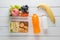 Lunch box set of Egg salad with sandwich slices in box and almond, peanut butter cracker with fruits and vegetables in boxs,