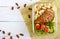 Lunch boxLunch box: rotini with baked chicken breast and salad on a white wooden background.